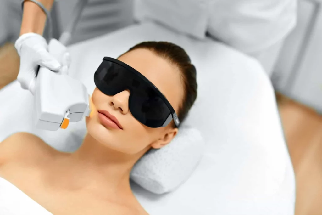 Divine MedSpa aesthetician giving IPL Laser Treatment to Lady | Ormond Beach, FL