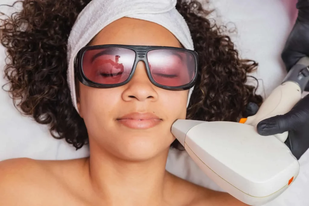 Woman with Curly Hair receiving Skin Treatments at Divine Med Spa