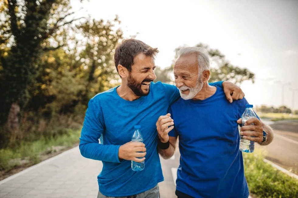 Old Age Man with Young Man Smiling at Divine MedSpa | Ormond Beach