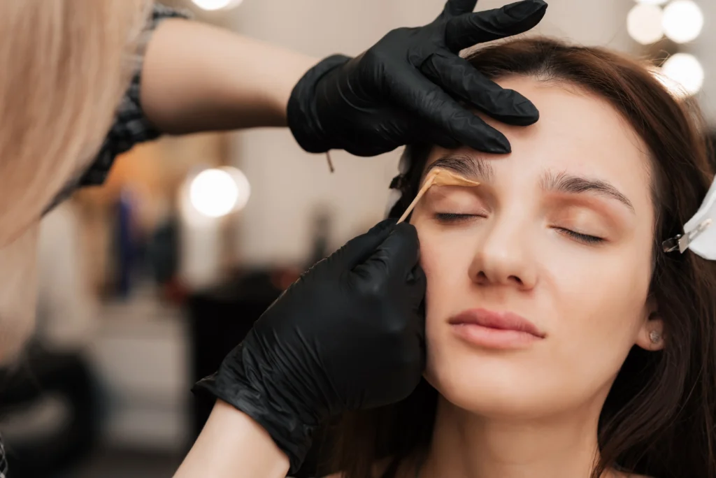 Woman Receiving Brow Waxing Services at Divine Medspa in Ormond Beach